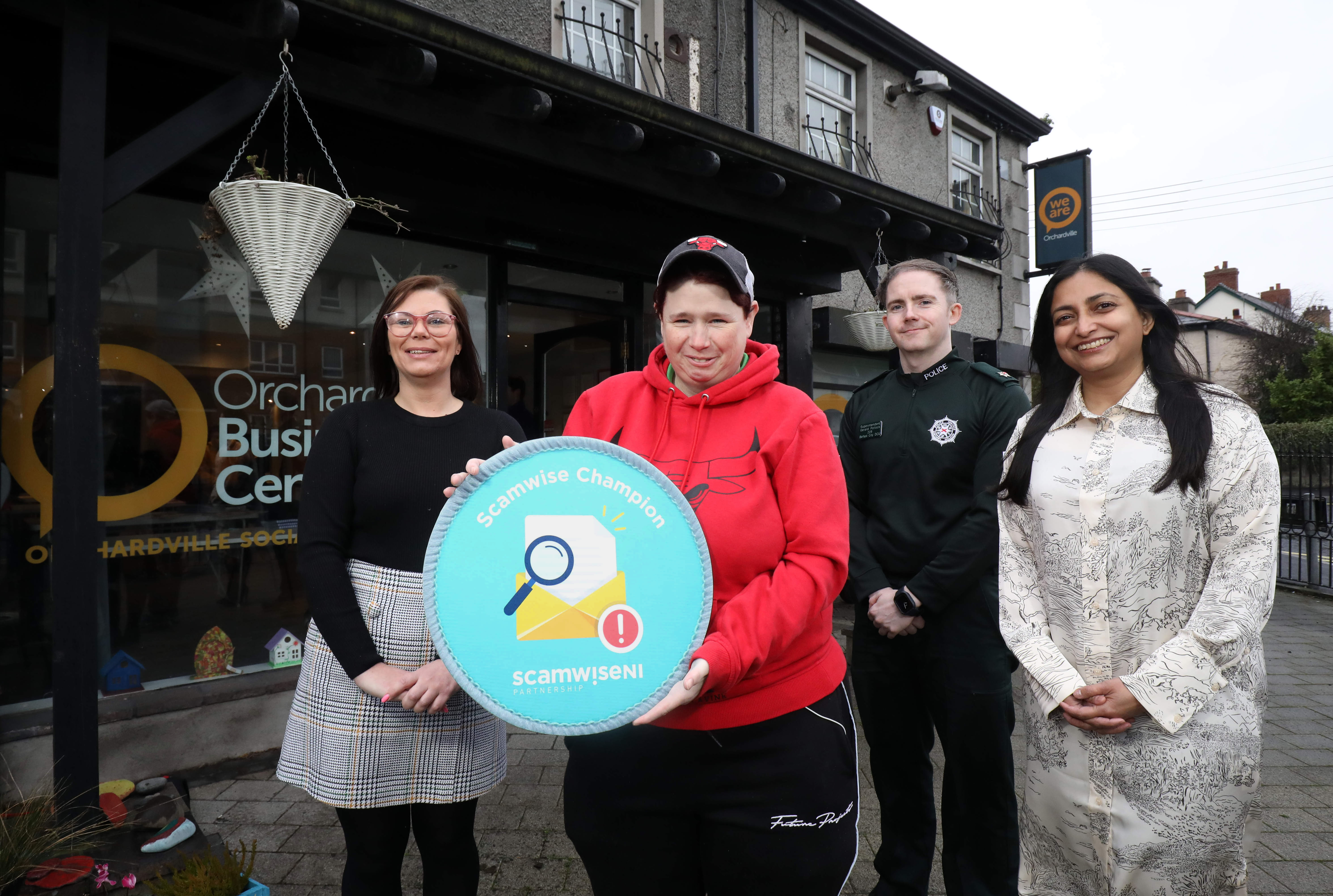 Superintendent Gerard Pollock (PSNI), Noyona Chundur (the Consumer Council), Laura Jamison (Orchardville Society) and Gemma O'Keefe officially launch the Scamwise Champion – Easy Read programme at the Orchadrville Society, Bangor. The programme has been designed to help people with learning difficulties to stay safe from scams.