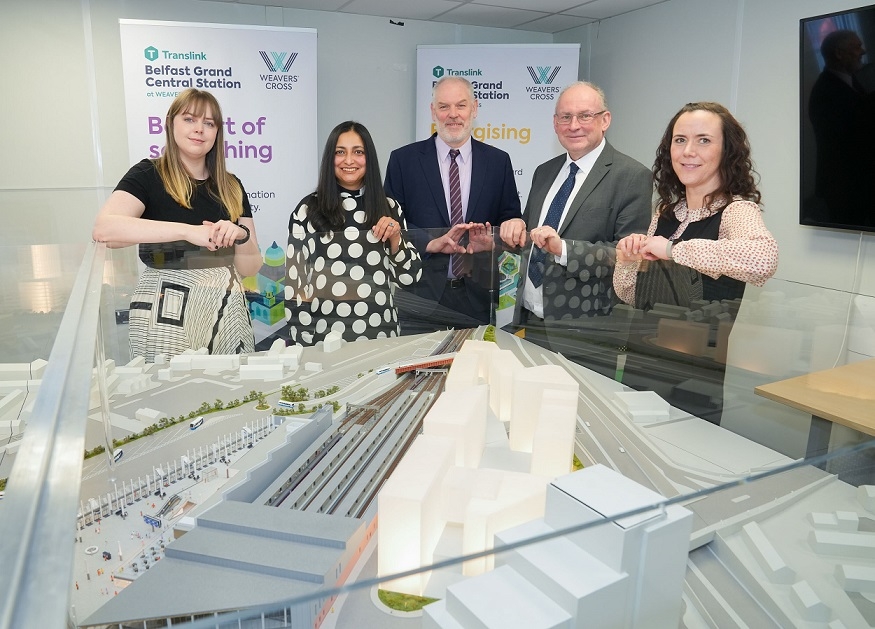 Staff members from the Consumer Council and Translink looking at model of what the new Belfast Grand Central Hub will look like